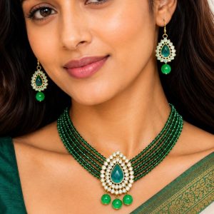 Close-up view of green beaded Kundan necklace pendant with decorative bead drops