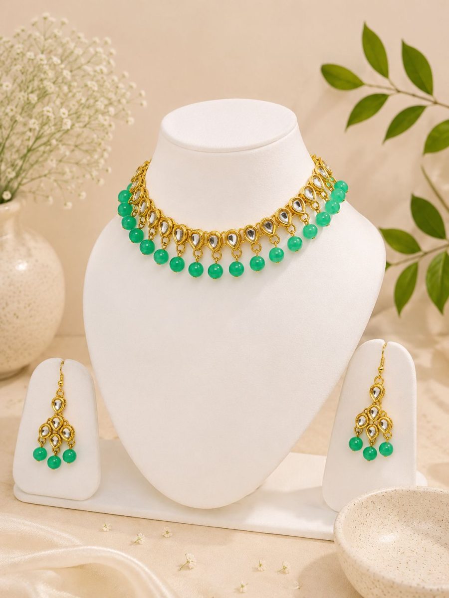 Gold plated Kundan choker with green bead detailing for women