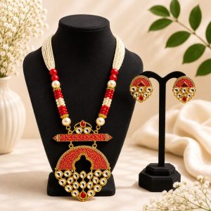 Red beaded Kundan necklace set with matching earrings and pearl strands