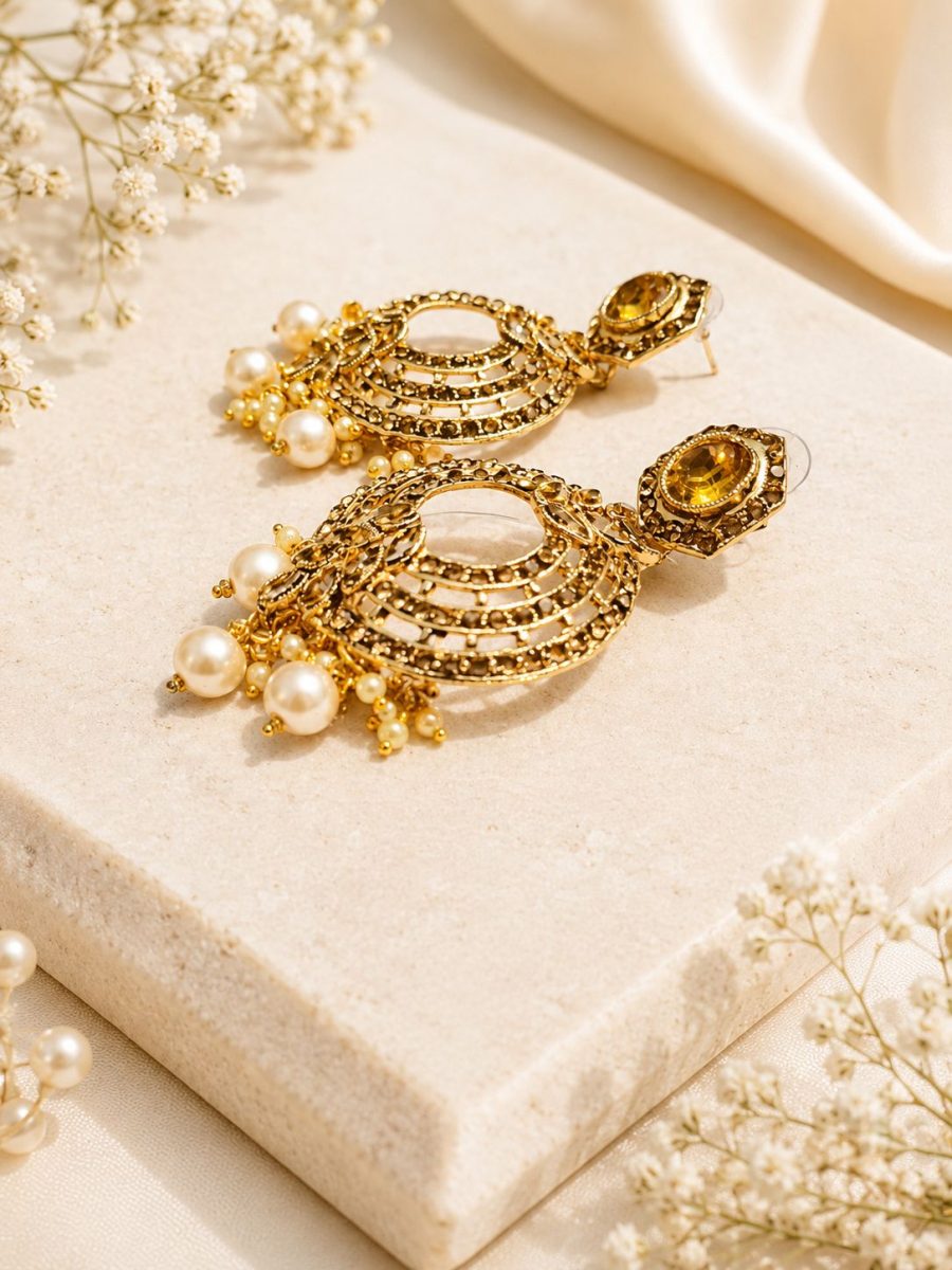 Ethnic gold tone chandbali earrings with white pearl accents