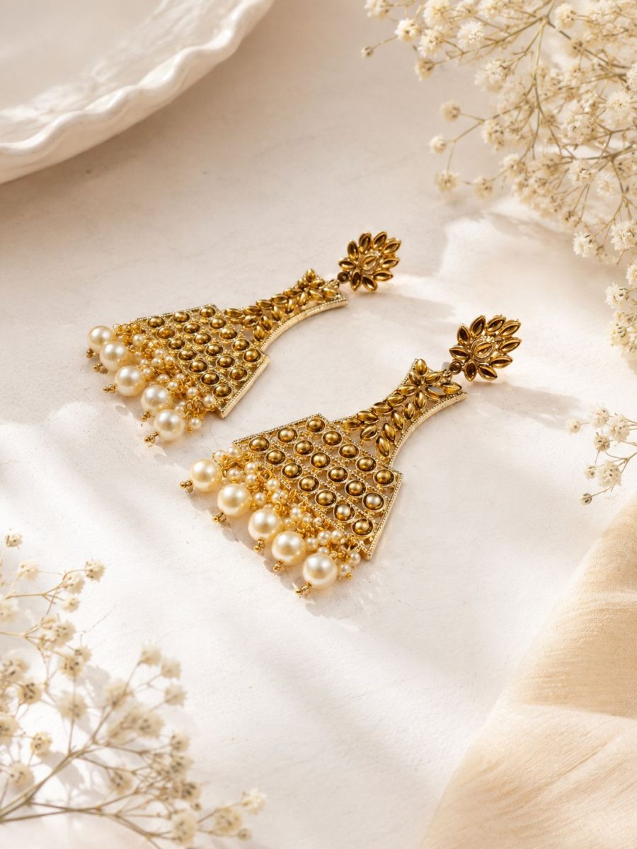 Traditional gold tone jhumka earrings with pearl drops
