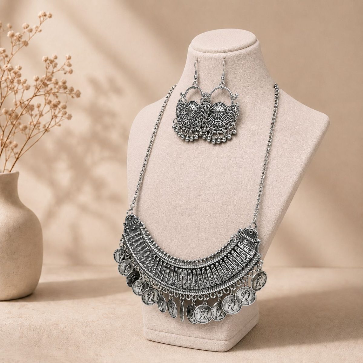 oxidesed coin necklace set on stand side view